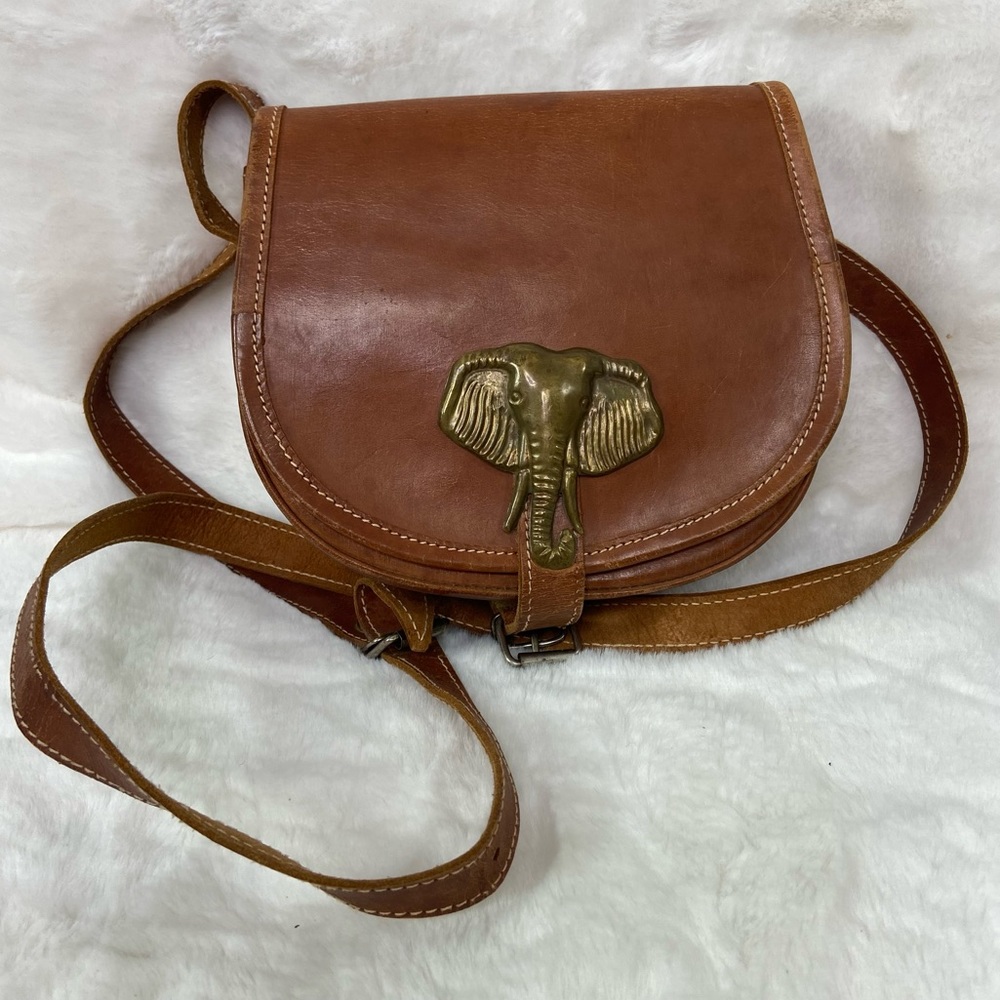 Handmade, small, leather bag, brass elephant, motif.
